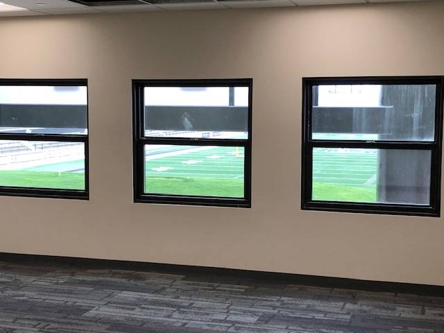 Windows looking out to the Jamie Hosford Football Center.